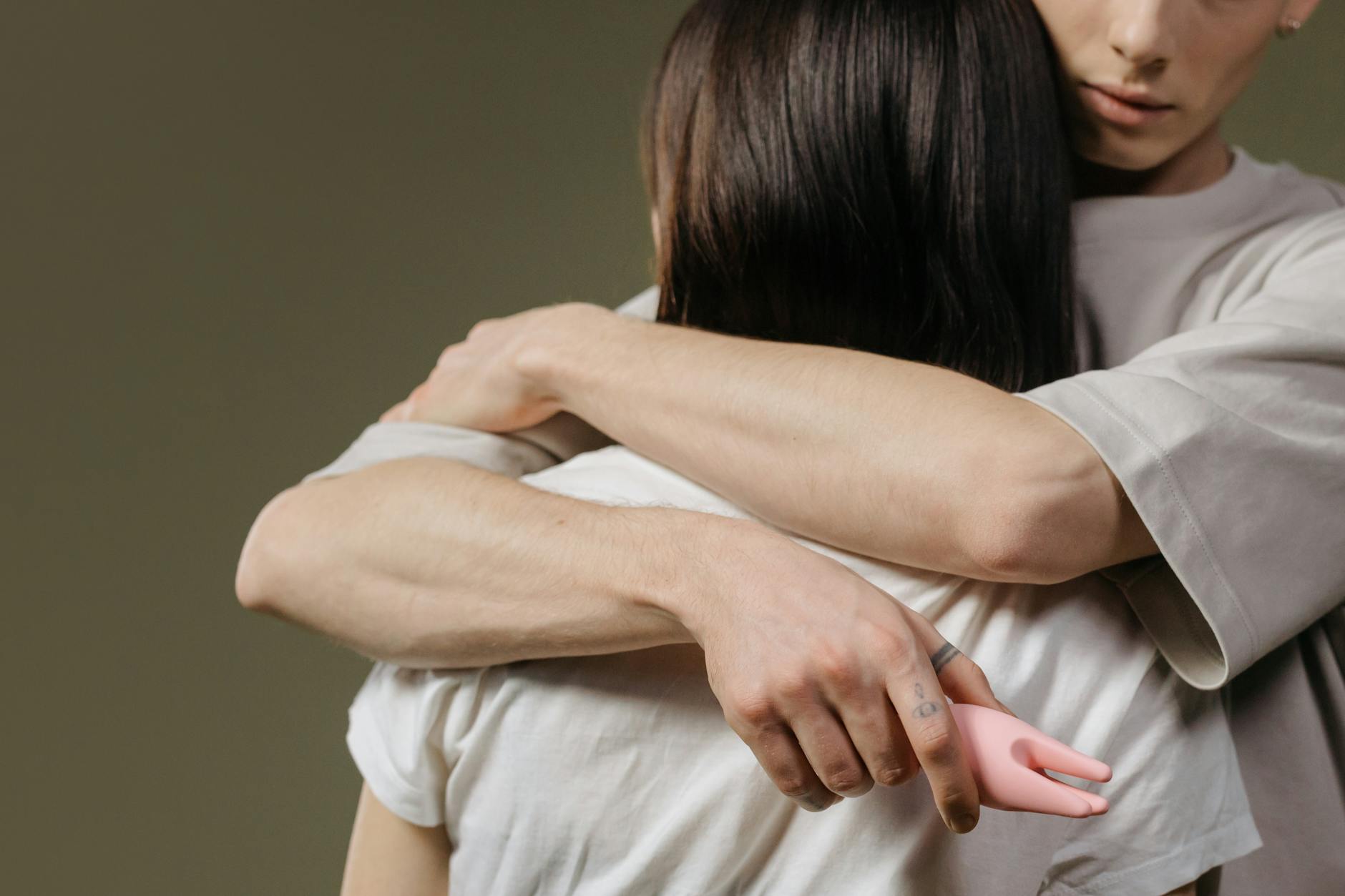 A couple embracing intimately, highlighting emotional and physical connection between partners.