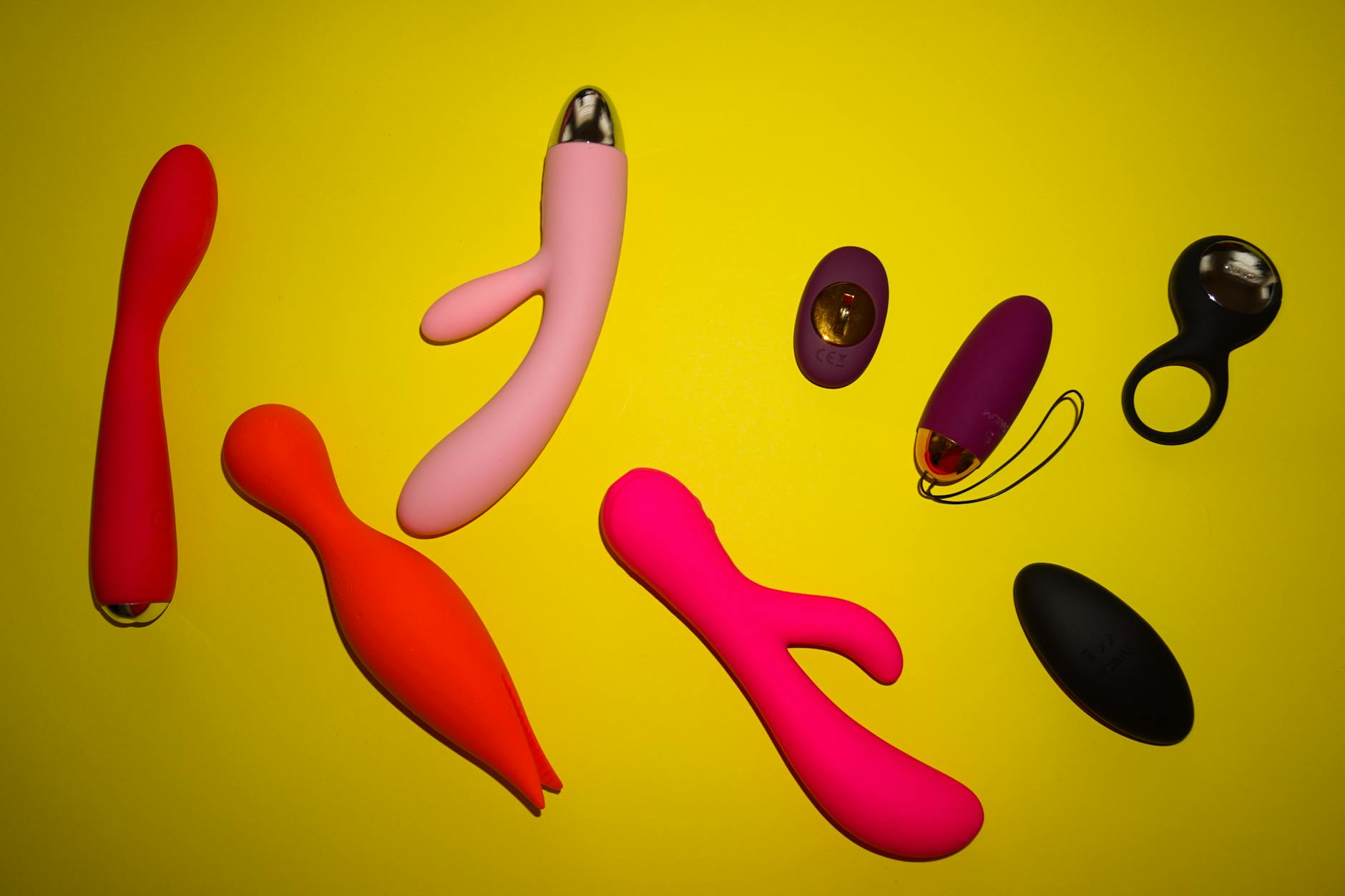 A blue silicone vibrator held in hand, symbolizing intentional self-pleasure and emotional reconnection